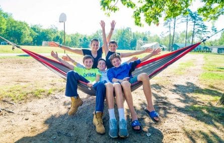 campers relaxing on a hammock